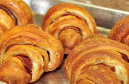 Golden croissants on a baking tray